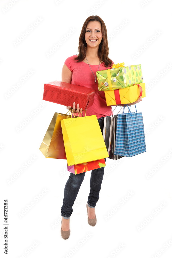 Happy woman with shopping bags and gifts