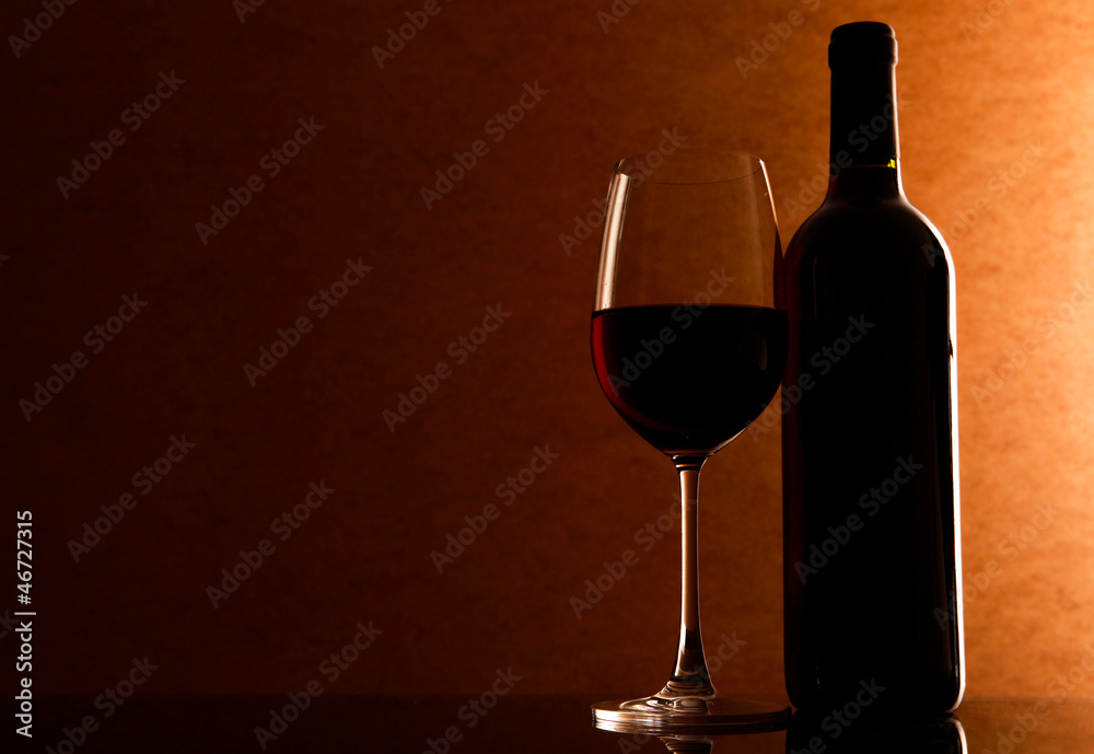 Fototapeta premium Bottle and Glass with red whine on the table