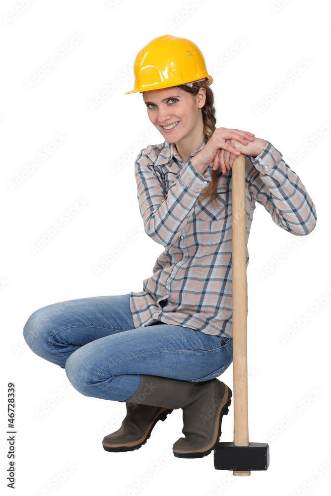 craftswoman holding a huge hammer craftswoman holding a huge hammer