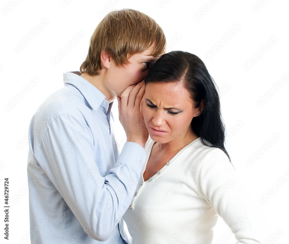 Man telling terrible secret to a woman. Isolated on white. Man telling terrible secret to a woman. Isolated on white.