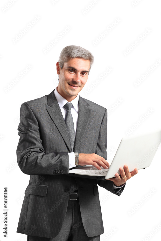 Smiling handsome businessman working with laptop. Smiling handsome businessman working with laptop.
