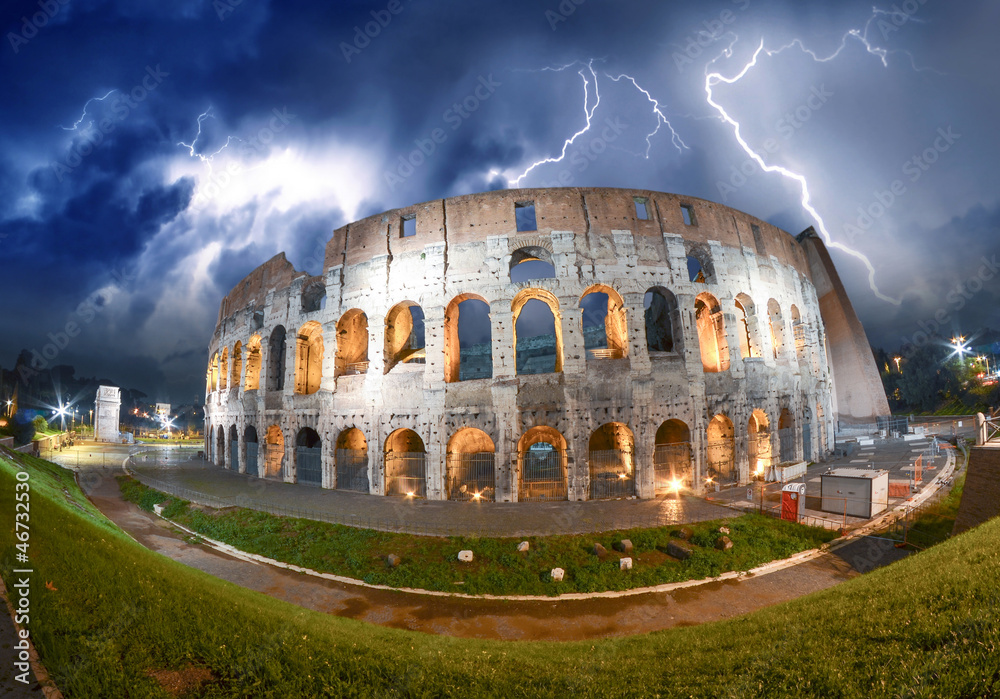 Colosseum - Rome. Night view with surrounding grass and park