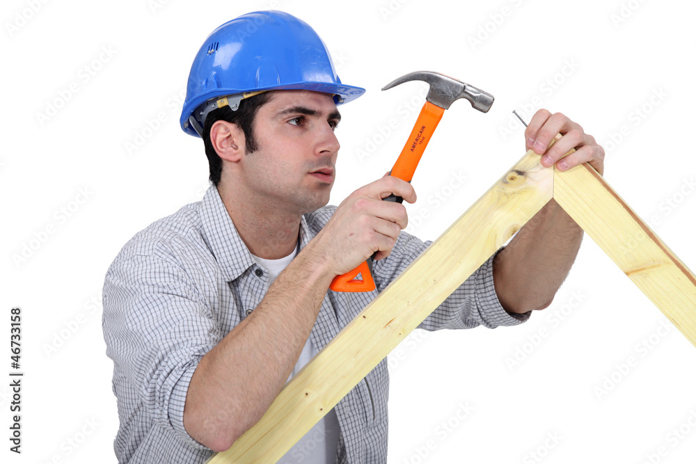 woodworker working with a hammer woodworker working with a hammer