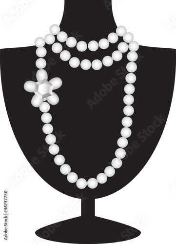 pearl necklace on black mannequin