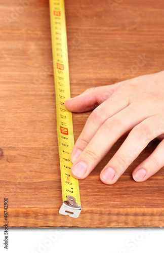 measuring wooden board close-up