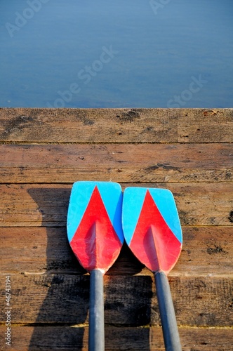 Two oars on wooden
