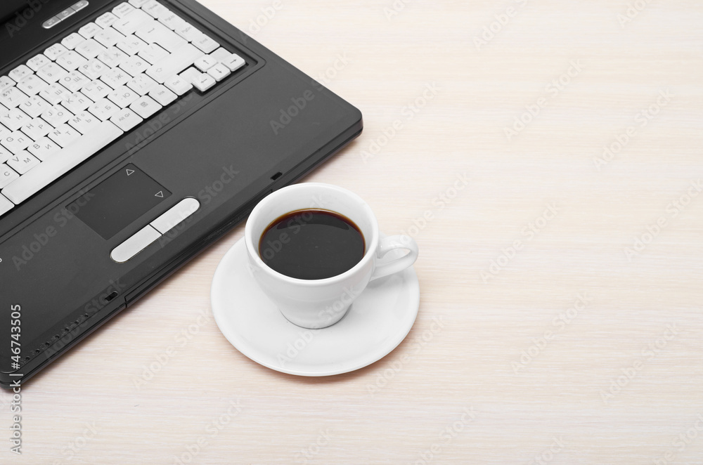 laptop with fresh cup of coffee and notebook laptop with fresh cup of coffee and notebook