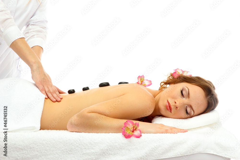 Obraz premium beautiful young woman in spa salon getting massage with spa