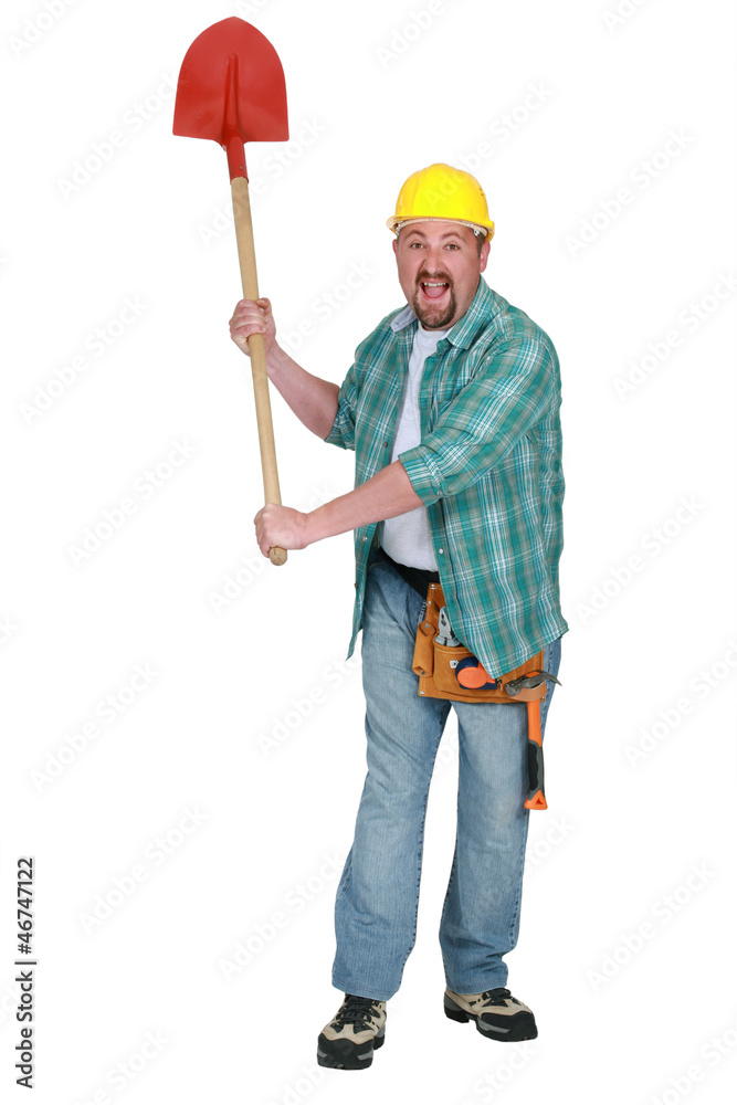 A delirious tradesman holding up a spade A delirious tradesman holding up a spade