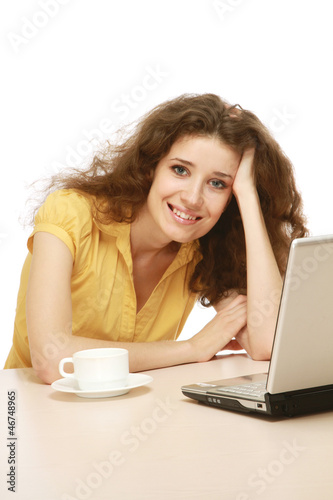 Smiling businesswoman at her working place isolated