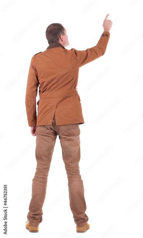 Back view of man in jacket pointing. Back view of man in jacket pointing.