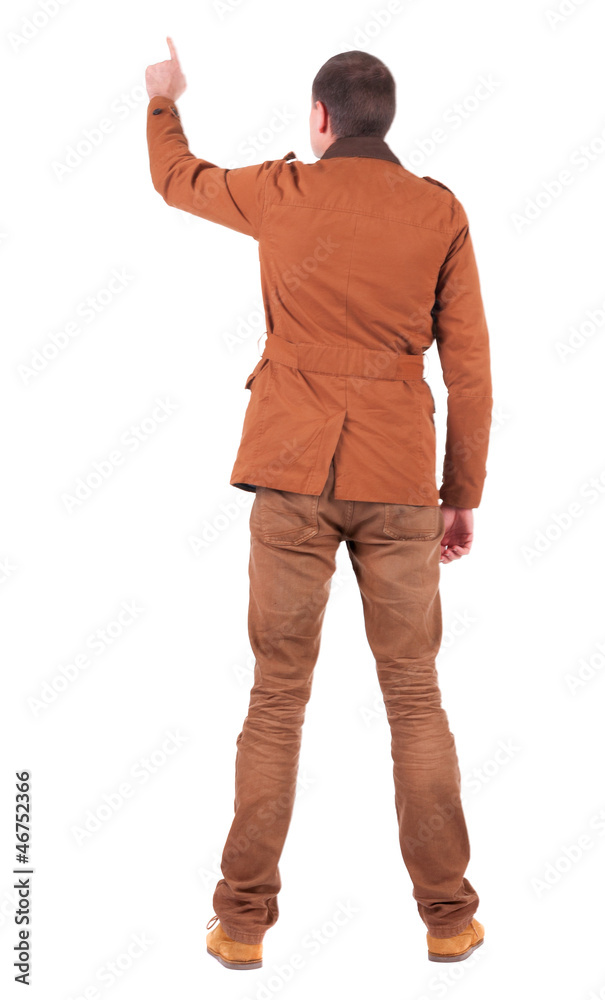 Fototapeta premium Back view of man in jacket pointing.