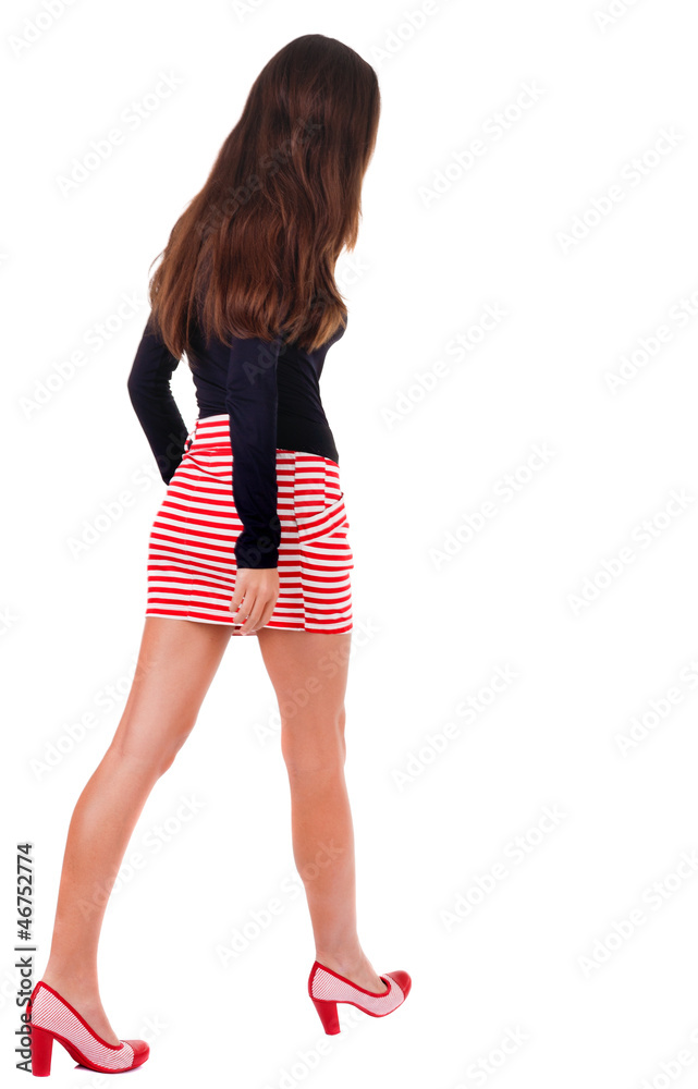 back view of going woman in red dress. back view of going woman in red dress.