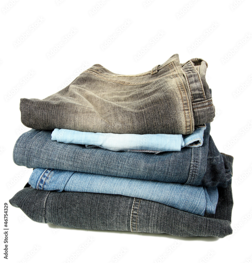 Lot of different jeans isolated on white Lot of different jeans isolated on white