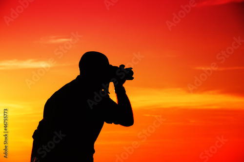 Photographer in sunset