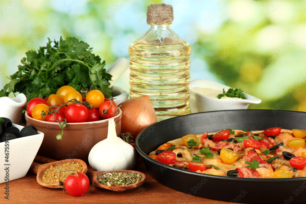 colorful composition of delicious pizza, vegetables and spices colorful composition of delicious pizza, vegetables and spices