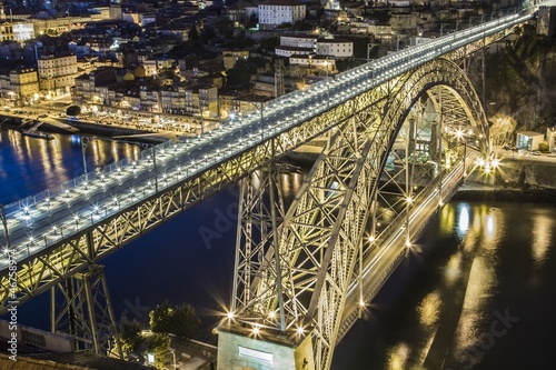 Dom Luis bridge over Douro river at night in Porto Portugal