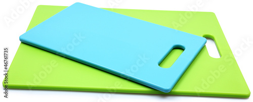 Stack of Blue and Green Silicone Cutting Boards over white. photo