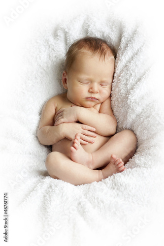 newborn baby sleeping on a white blanket
