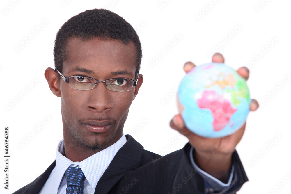 Businessman holding a globe Businessman holding a globe