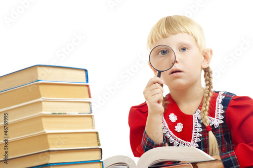 Vászonkép girl reading with loupe