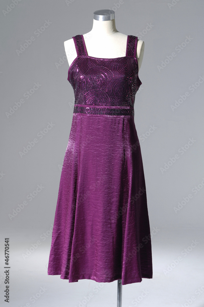 Elegant female red evening on a mannequin-gray background Elegant female red evening on a mannequin-gray background