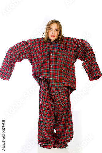 Child wearing extra large pajamas photo