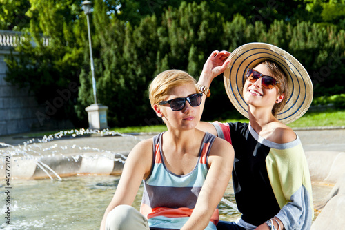 Travel two woman and sideseeing foutain with big smile photo