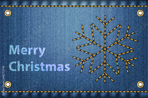 Christmas greetings on blue jeans background