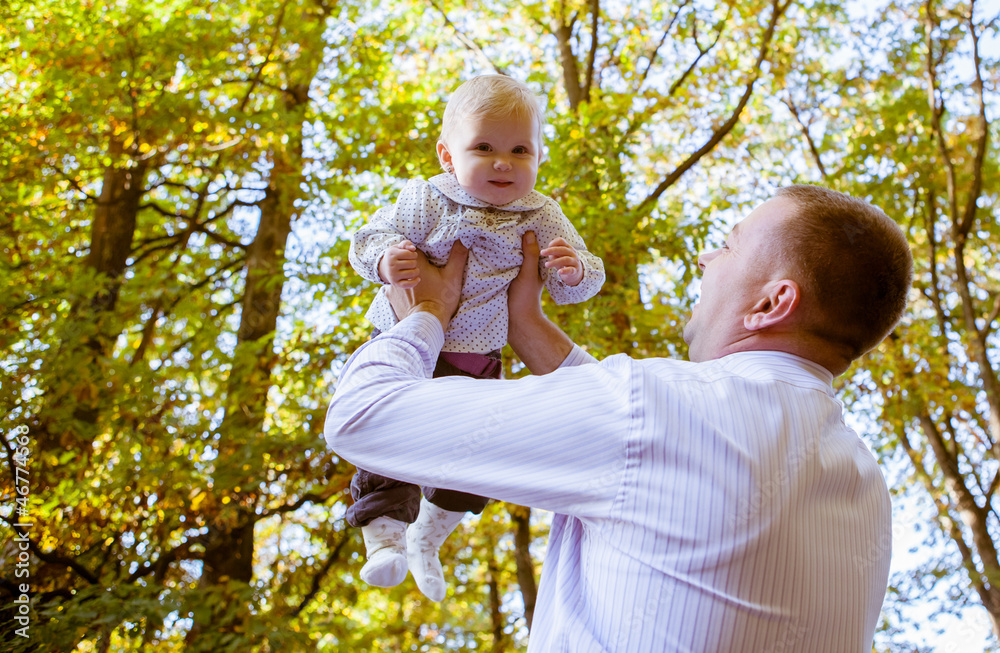 Happy father and his baby daughter having fun in the park Happy father and his baby daughter having fun in the park