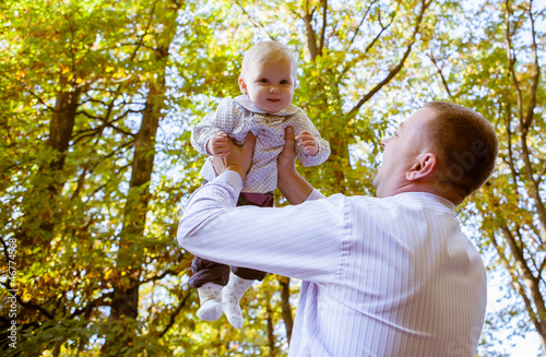 Happy father and his baby daughter having fun in the park © Andriy Petrenko