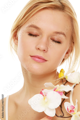 Closeup of a beautiful woman holding a flower