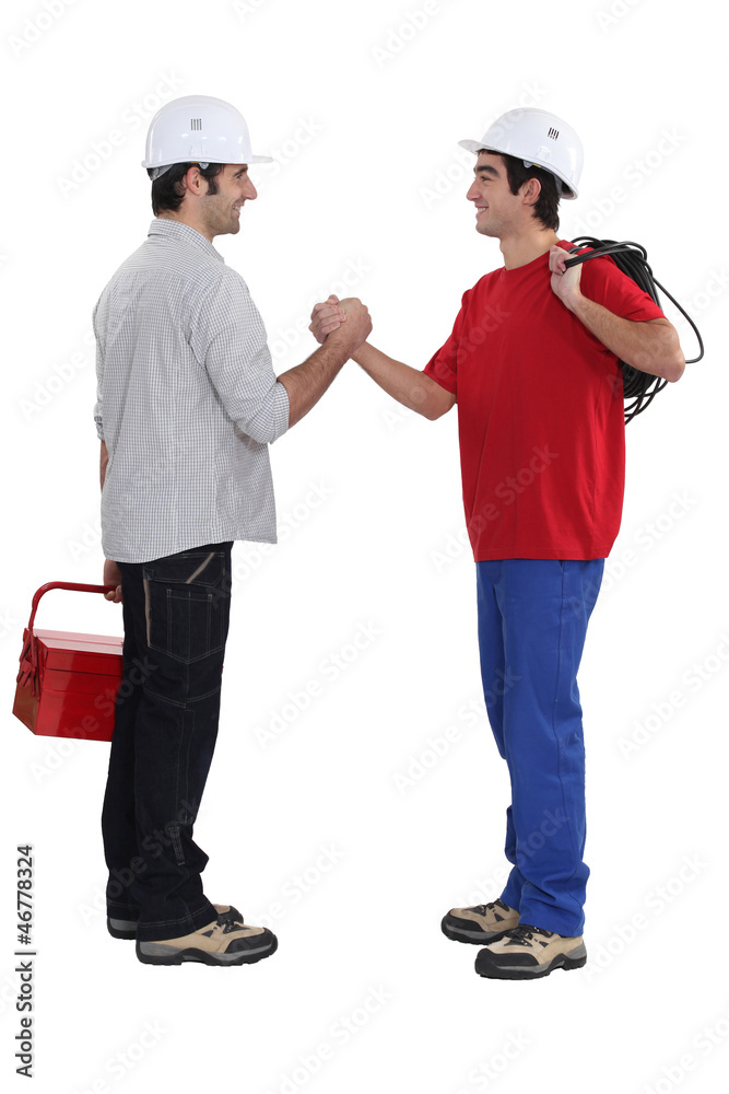 Two artisans greeting each other