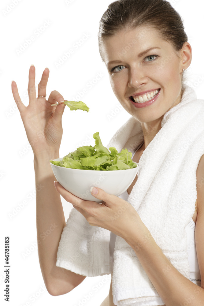 young woman eating salad after fitness young woman eating salad after fitness