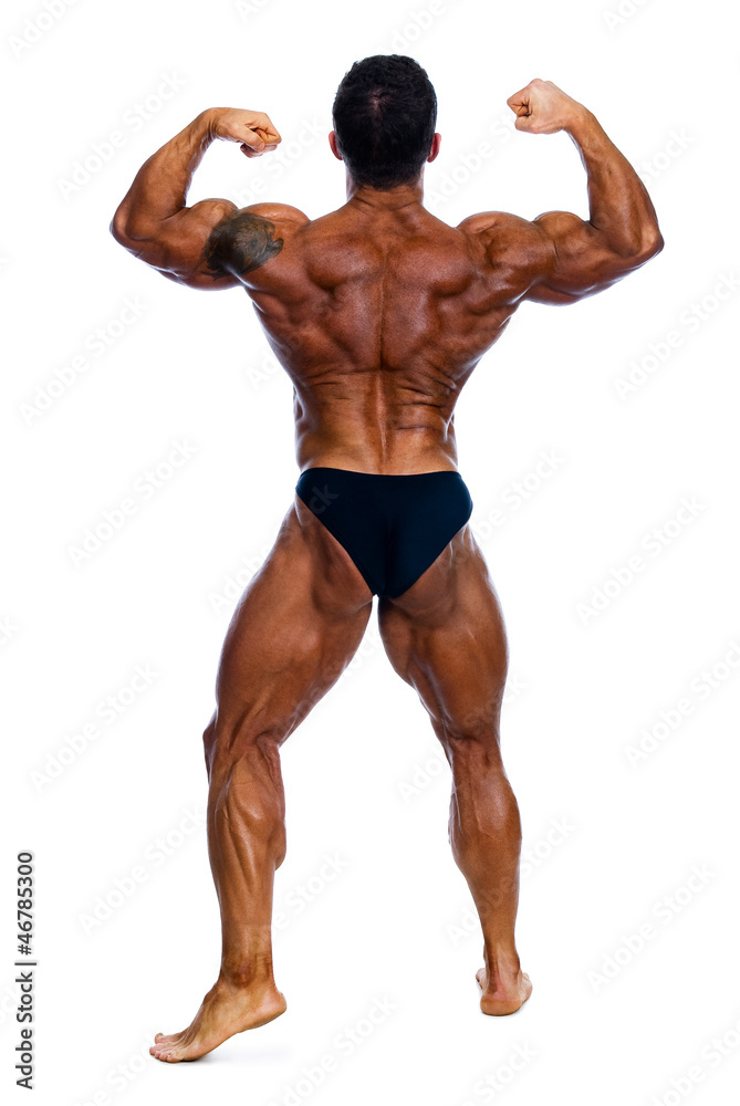 Muscled male model posing in studio Muscled male model posing in studio