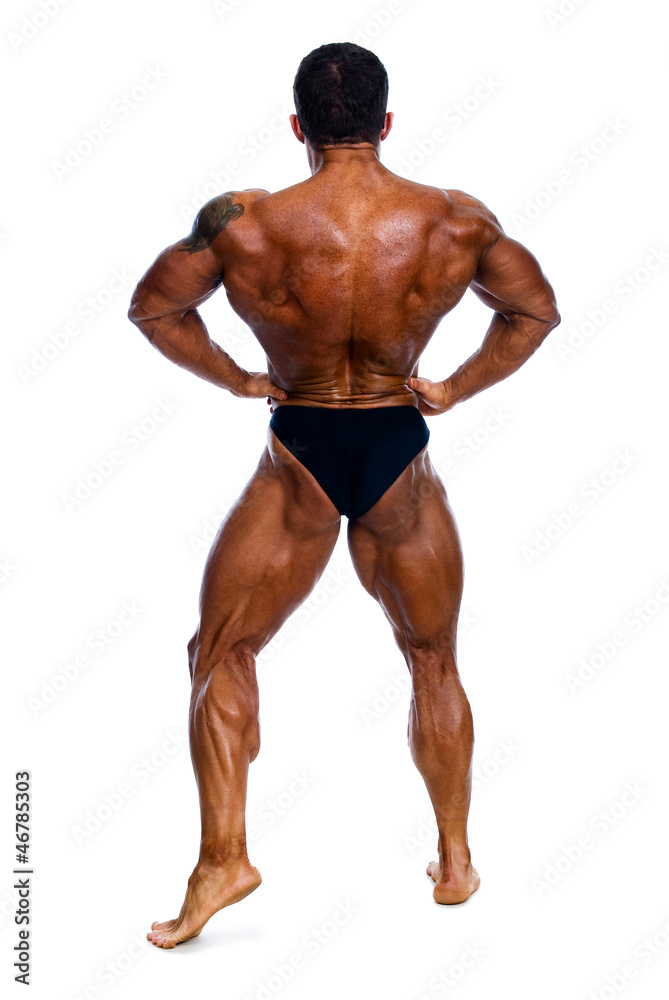 Muscled male model posing in studio Muscled male model posing in studio