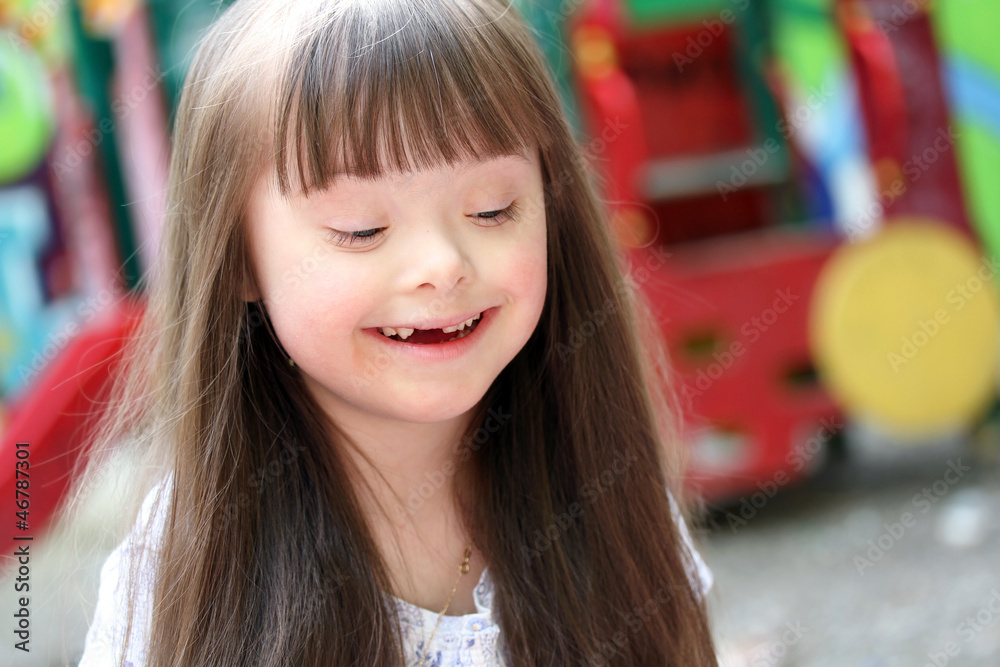 Fototapeta premium Portrait of beautiful young girl on the playground.