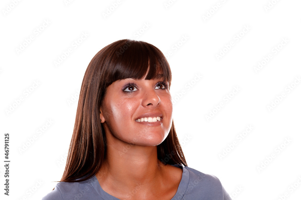 Friendly young woman looking up on blue blouse Friendly young woman looking up on blue blouse