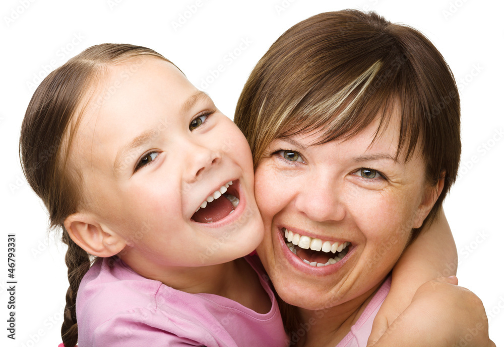 Portrait of a happy mother hugging her daughter Portrait of a happy mother hugging her daughter