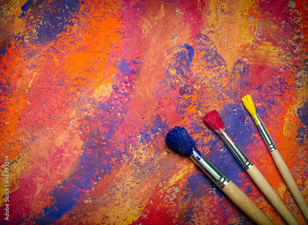 Fototapeta premium Paintbrushes on abstract grange background