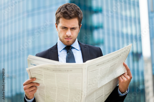 Man reading a newspaper photo