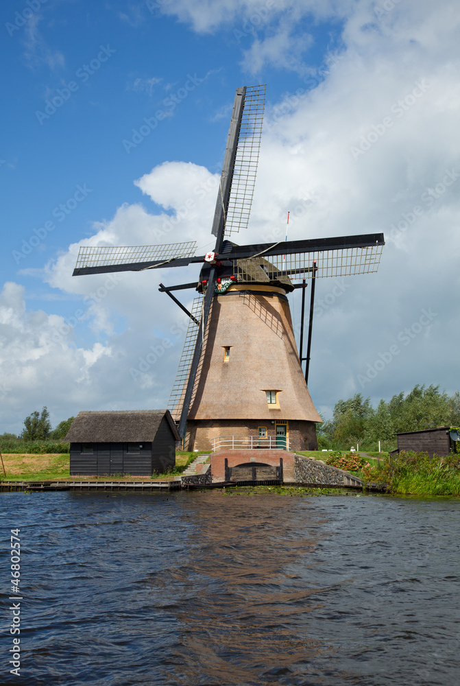 Windmill in Kinderdijk against Blue Sky