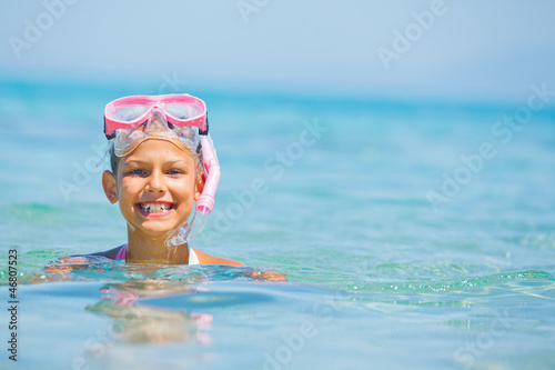 Cute girl playing in the sea