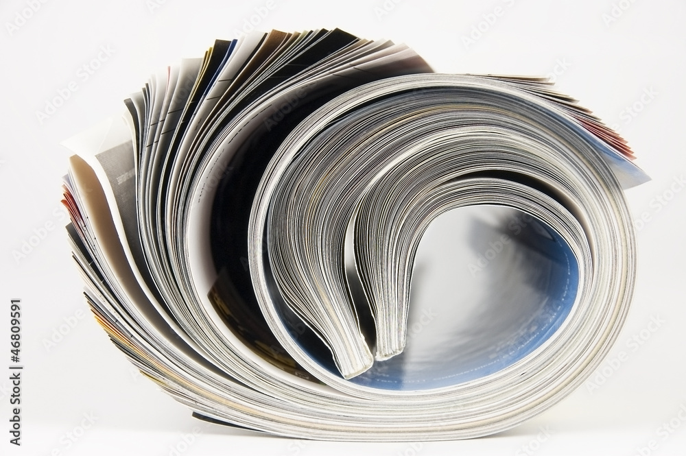 Rolled up magazines over white background Rolled up magazines over white background