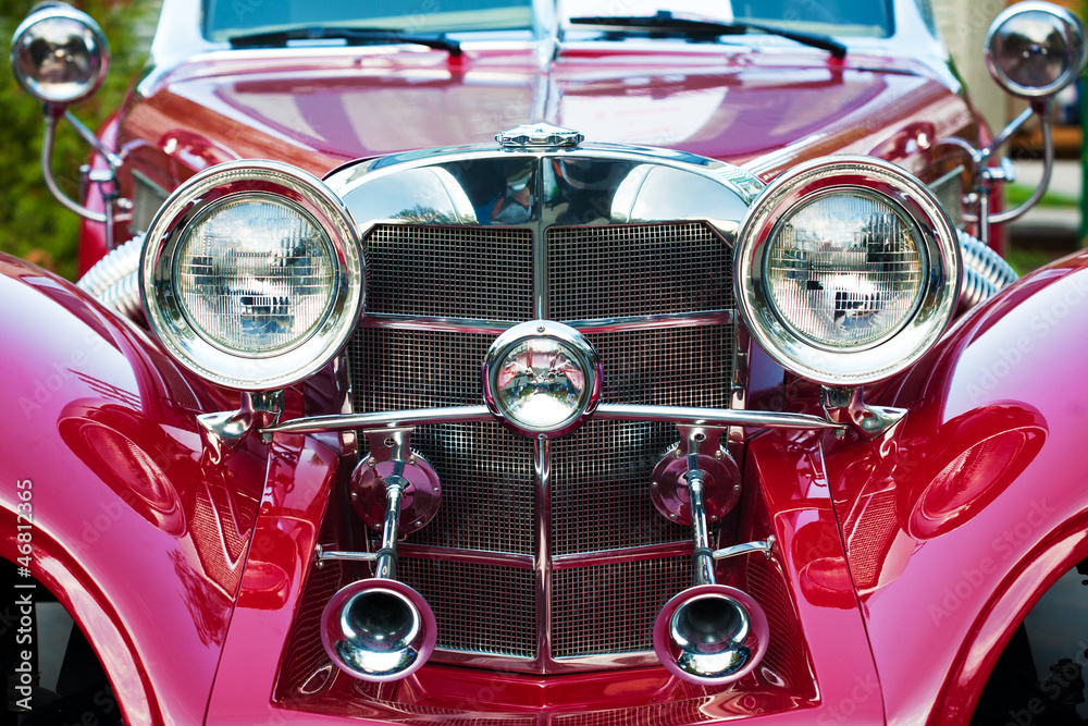 front of beautiful red vintage car