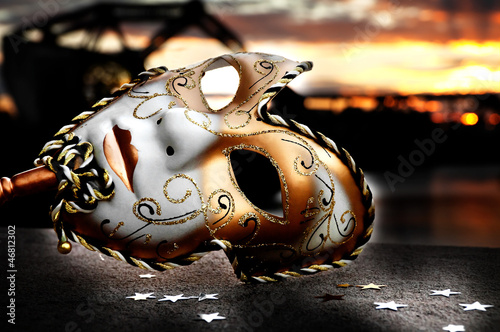 Venetian Mask by the River Bridge with Sunset