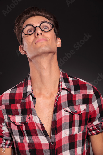 casual man wearing glasses  looking up © Viorel Sima