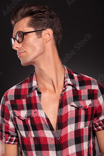 profile of a casual young man wearing glasses