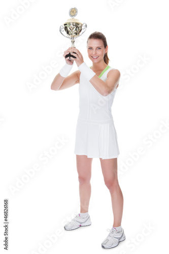 Jubilant winner holding up the trophy