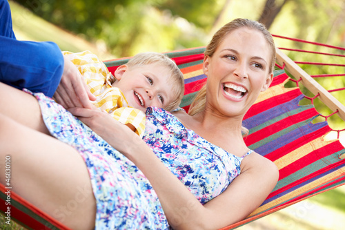 Mother And Son Relaxing In Hammock